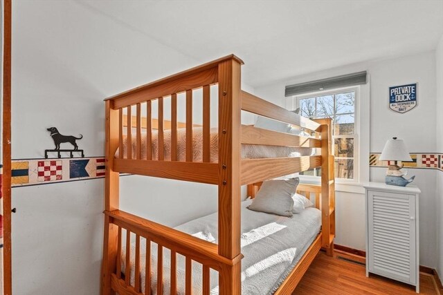 bedroom with hardwood / wood-style floors