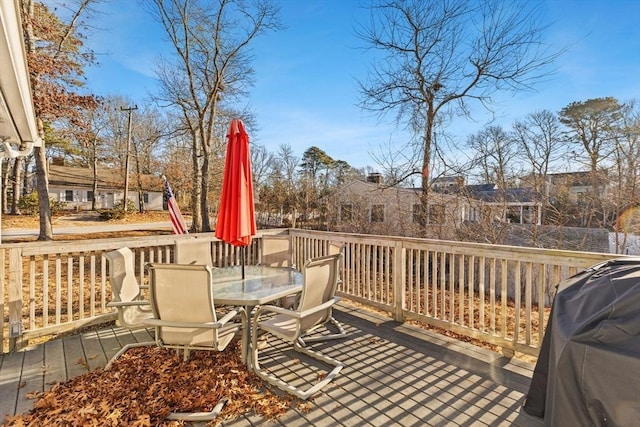 wooden terrace featuring area for grilling