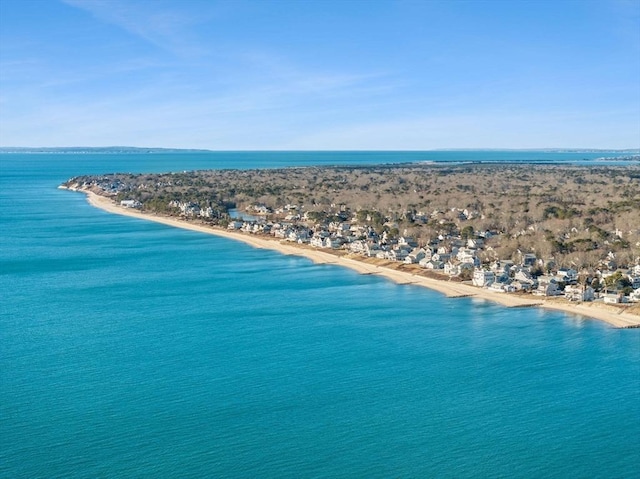 drone / aerial view featuring a water view and a beach view