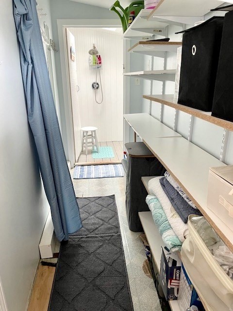 bathroom with hardwood / wood-style floors