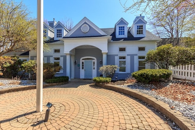 view of front of home with fence