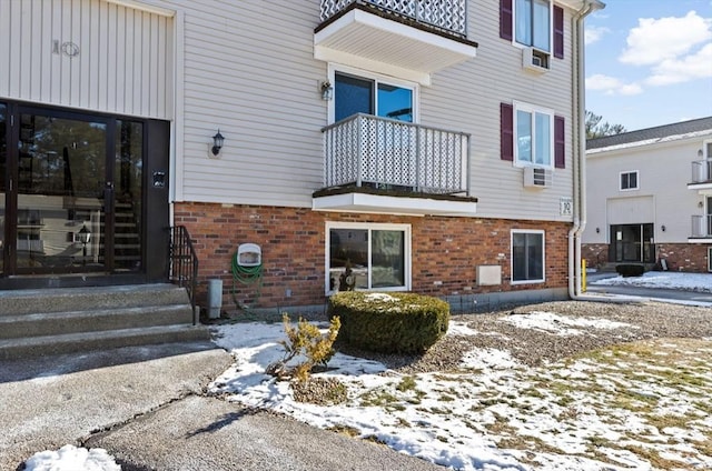 view of snow covered property entrance