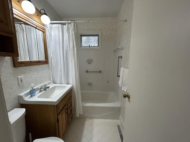 bathroom featuring tile patterned flooring, shower / tub combo, vanity, toilet, and wallpapered walls