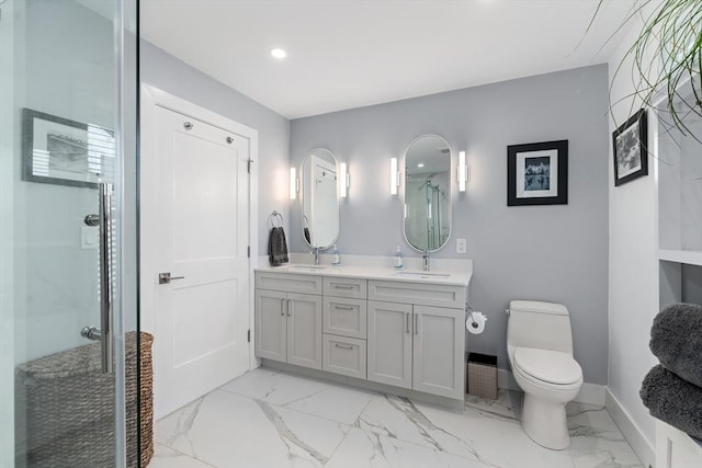 full bath with a stall shower, marble finish floor, and a sink