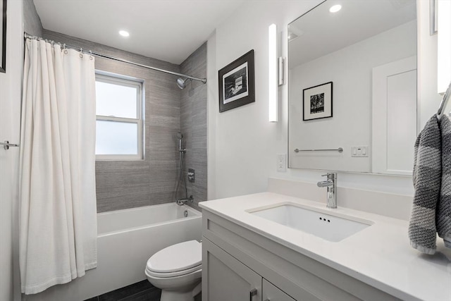 full bath featuring recessed lighting, vanity, toilet, and shower / tub combo