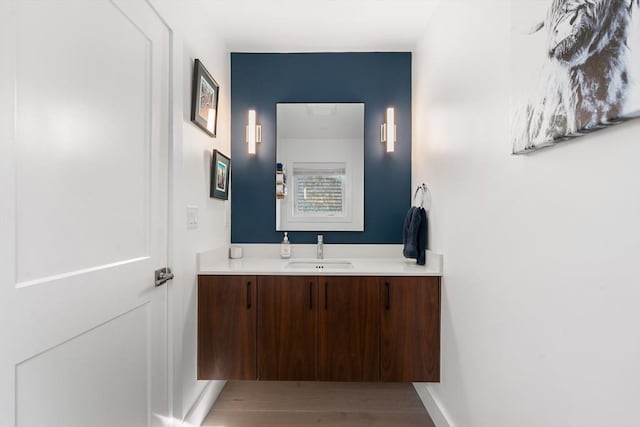 bathroom featuring baseboards and vanity