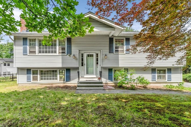 36 Fontaine St, Marlborough, MA 01752 - split foyer home with a front yard and a chimney