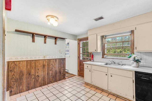 36 Fontaine St, Marlborough, MA 01752 - kitchen featuring black dishwasher, open shelves, light countertops, tasteful backsplash, and wood walls