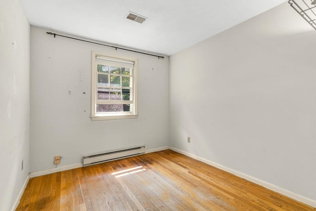 36 Fontaine St, Marlborough, MA 01752 - spare room featuring a baseboard radiator and hardwood / wood-style floors