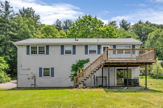 36 Fontaine St, Marlborough, MA 01752 - back of property with a wooden deck, stairway, view of wooded area, and a chimney