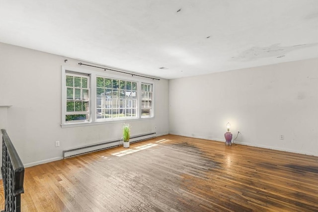36 Fontaine St, Marlborough, MA 01752 - unfurnished living room with baseboard heating and hardwood / wood-style flooring