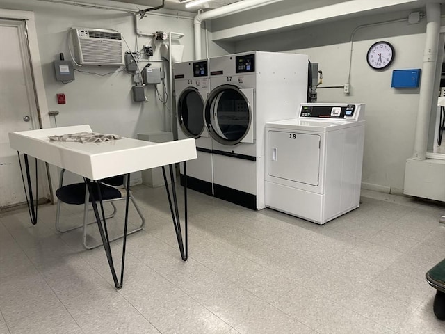 57 Broadlawn Park Unit 24, Boston, MA 02467 - community laundry room featuring independent washer and dryer, a wall mounted air conditioner, and baseboards