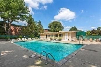 57 Broadlawn Park Unit 24, Boston, MA 02467 - community pool featuring a patio