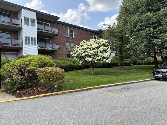 57 Broadlawn Park Unit 24, Boston, MA 02467 - view of apartment building / complex with uncovered parking