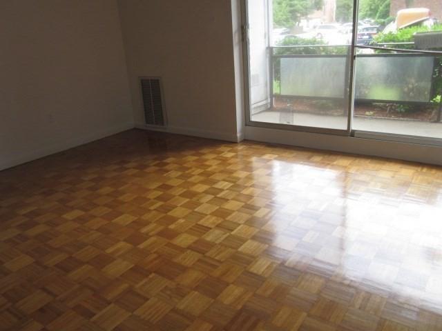 57 Broadlawn Park Unit 24, Boston, MA 02467 - spare room featuring baseboards