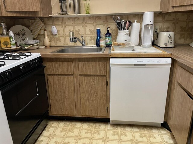 57 Broadlawn Park Unit 24, Boston, MA 02467 - kitchen featuring white dishwasher, gas range oven, a sink, and tasteful backsplash