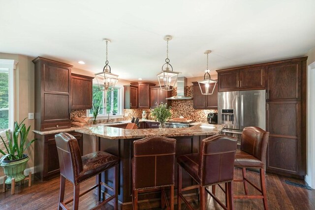 50 Elm St, Plympton, MA 02367 - kitchen featuring wall chimney exhaust hood, plenty of natural light, light stone countertops, backsplash, and recessed lighting