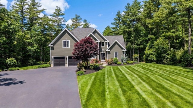 50 Elm St, Plympton, MA 02367 - view of front of property featuring a garage, driveway, and a front yard