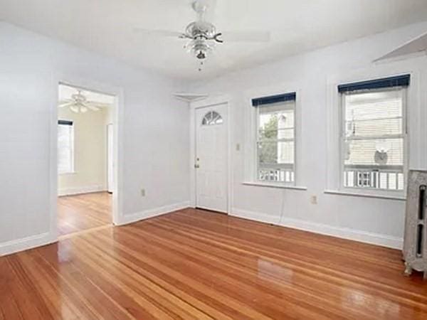8 Hall Ave Unit 2, Braintree, MA 02184 - entrance foyer with ceiling fan, wood finished floors, and baseboards