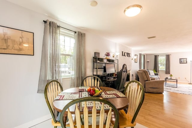 66 Captain Cook Ln Unit 66, Barnstable, MA 02632 - dining space featuring plenty of natural light, light wood-style flooring, and baseboards