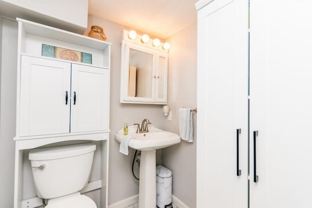 66 Captain Cook Ln Unit 66, Barnstable, MA 02632 - bathroom with toilet and baseboards