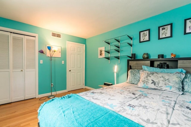 66 Captain Cook Ln Unit 66, Barnstable, MA 02632 - bedroom with wood finished floors, a closet, and baseboards