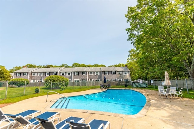 66 Captain Cook Ln Unit 66, Barnstable, MA 02632 - community pool featuring a patio and a residential view