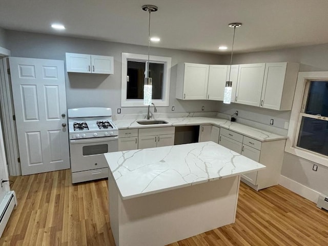 kitchen with light stone counters, a baseboard radiator, white range with gas stovetop, a sink, and dishwasher