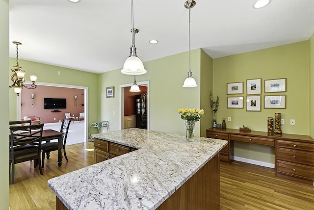 26 Waterville Ln, Shrewsbury, MA 01545 - kitchen featuring light wood-style floors, a center island, a chandelier, light stone counters, and recessed lighting