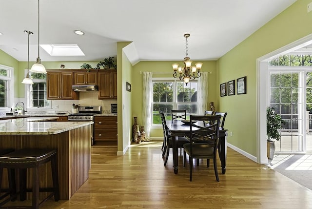 26 Waterville Ln, Shrewsbury, MA 01545 - kitchen featuring stainless steel range with gas stovetop, light wood-style flooring, a chandelier, healthy amount of natural light, and recessed lighting