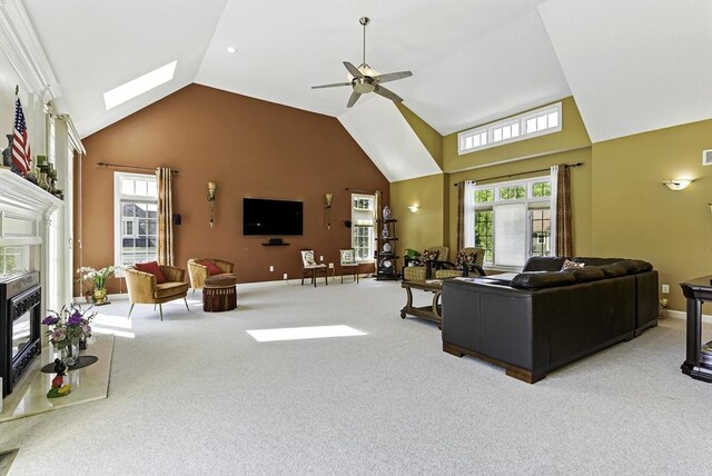 26 Waterville Ln, Shrewsbury, MA 01545 - living area with carpet, high vaulted ceiling, ceiling fan, a fireplace, and baseboards