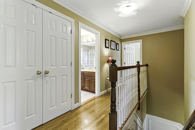 26 Waterville Ln, Shrewsbury, MA 01545 - hall with an upstairs landing, light wood-type flooring, and crown molding