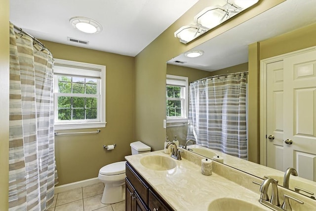 26 Waterville Ln, Shrewsbury, MA 01545 - full bathroom featuring healthy amount of natural light, tile patterned floors, toilet, and double vanity