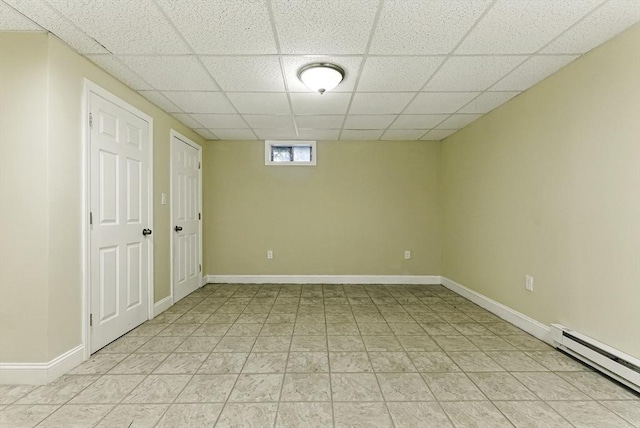 26 Waterville Ln, Shrewsbury, MA 01545 - basement featuring baseboard heating, a paneled ceiling, and baseboards