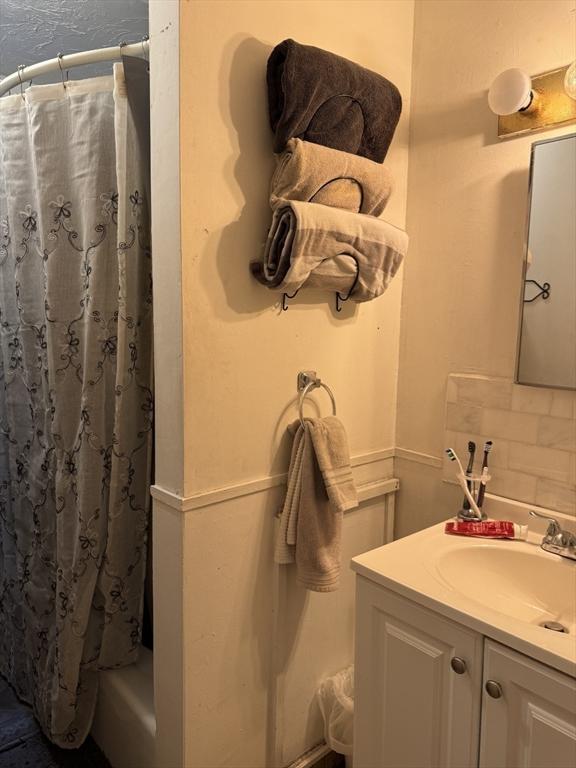 348 Fairmount St, Fitchburg, MA 01420 - bathroom featuring vanity and decorative backsplash