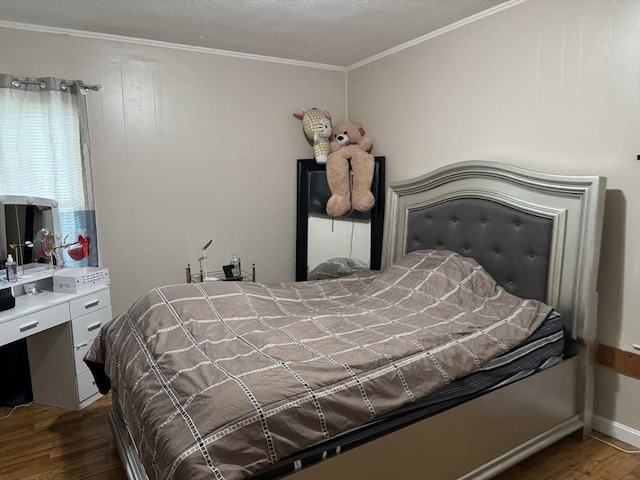 348 Fairmount St, Fitchburg, MA 01420 - bedroom featuring dark wood-type flooring and crown molding