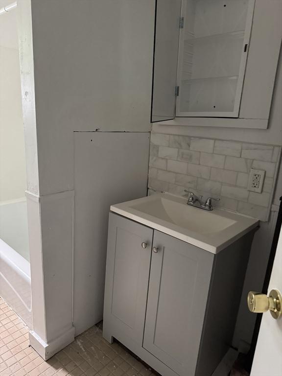 348 Fairmount St, Fitchburg, MA 01420 - bathroom with tasteful backsplash and vanity