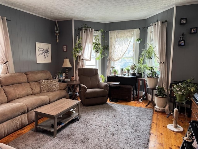 348 Fairmount St, Fitchburg, MA 01420 - living room with ornamental molding, hardwood / wood-style floors, and wood walls