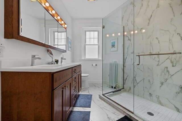 bathroom with radiator, marble finish flooring, a marble finish shower, and toilet