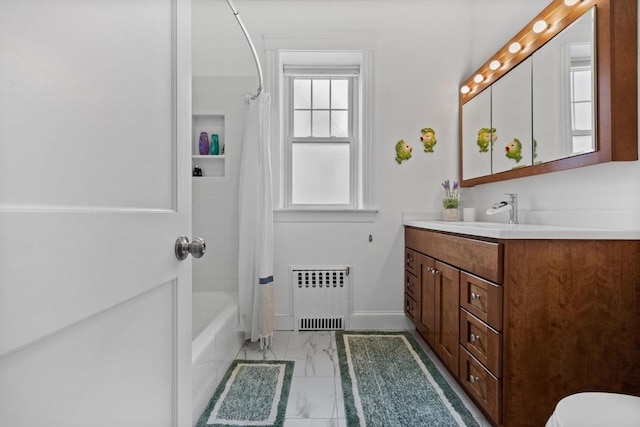bathroom featuring radiator, marble look tile flooring, vanity, shower / bath combination with curtain, and baseboards