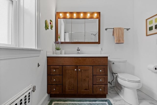 full bath featuring baseboards, toilet, vanity, and marble finish flooring