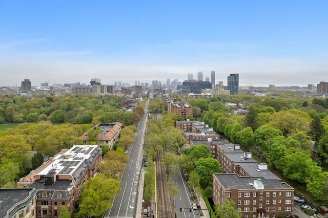 bird's eye view of a view of skyline and a tree filled landscape