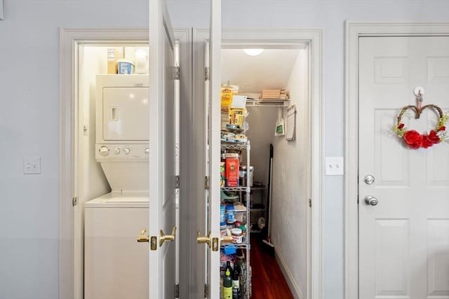 pantry with stacked washer / drying machine