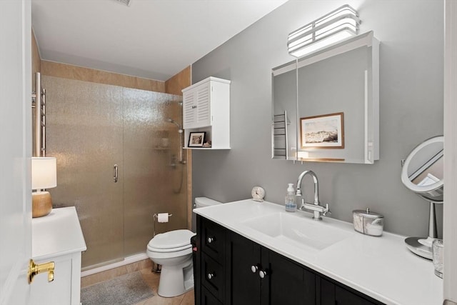 bathroom featuring walk in shower, vanity, and toilet