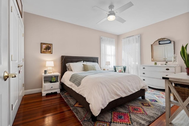 bedroom with dark wood-type flooring and ceiling fan