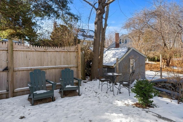 view of yard layered in snow