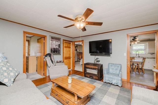 20 Wilcox St, Fall River, MA 02724 - living area with ceiling fan, wood finished floors, and ornamental molding