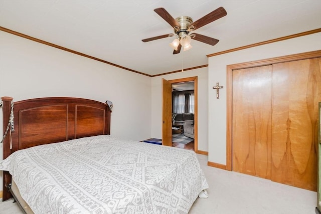 20 Wilcox St, Fall River, MA 02724 - bedroom featuring light colored carpet, crown molding, ceiling fan, baseboards, and a closet