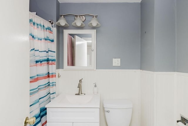 20 Wilcox St, Fall River, MA 02724 - full bathroom featuring wainscoting, vanity, and toilet