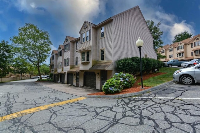 151 Mercury Ter Unit 151, Haverhill, MA 01832 - view of home's exterior with a garage, a residential view, and driveway